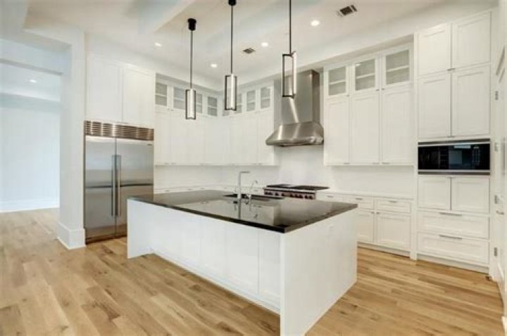 Should white cabinets match white walls?